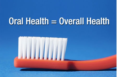 toothbrush underneath text reading "oral health = overall health"