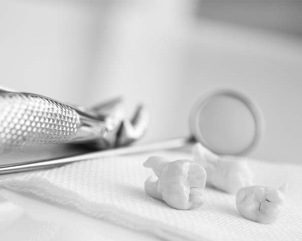 teeth on napkin, beside dental instruments