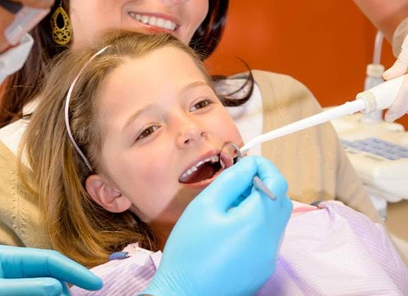 young girl undergoing dental treatment