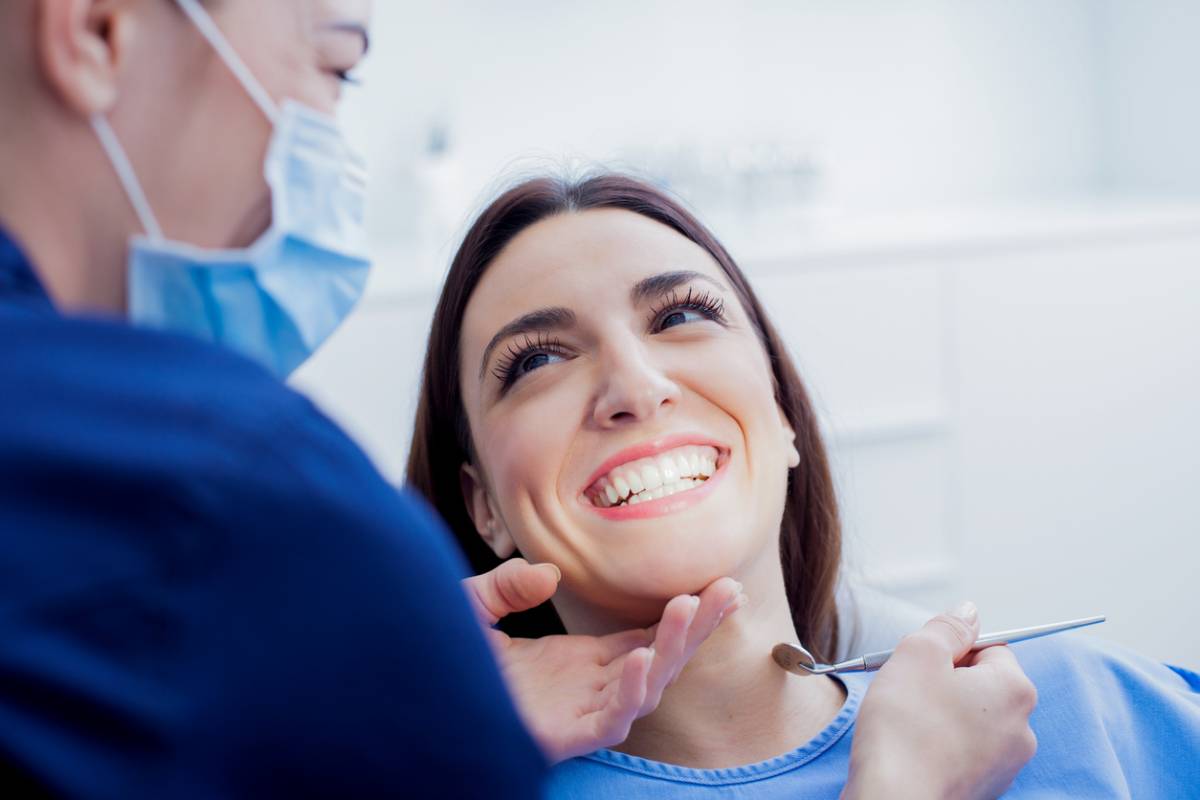 concept image of woman getting teeth cleaning twice a year